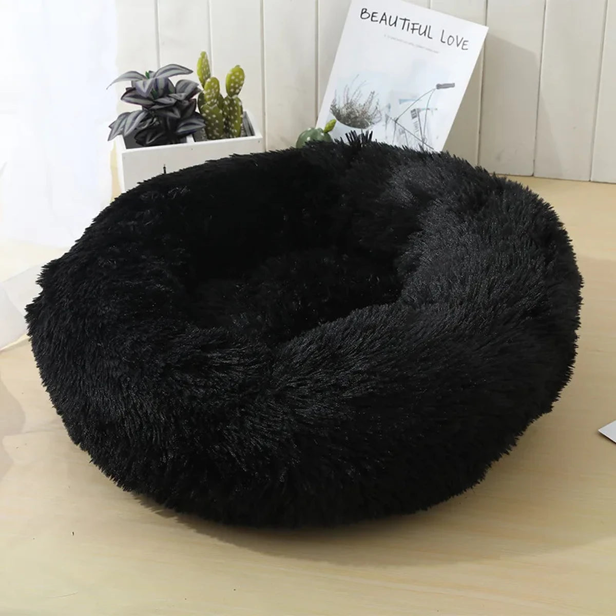 Lit rond en peluche noir pour chien