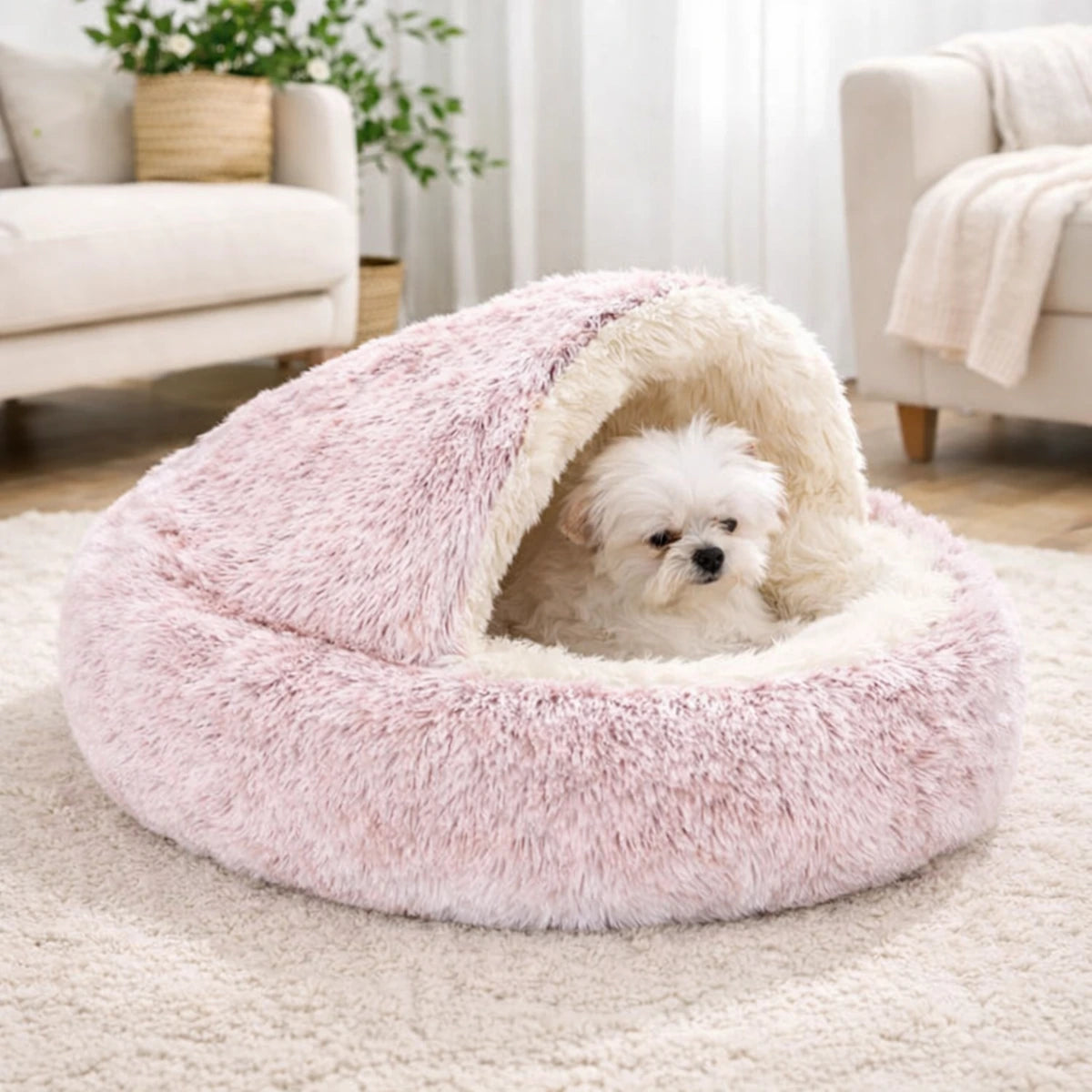 Lit apaisant pour chien rose avec coussin effet cocon, chien reposant à l’intérieur